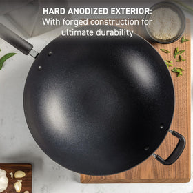 T-Fal Ultimate wok handle closeup with riveted silicone grip for comfort.