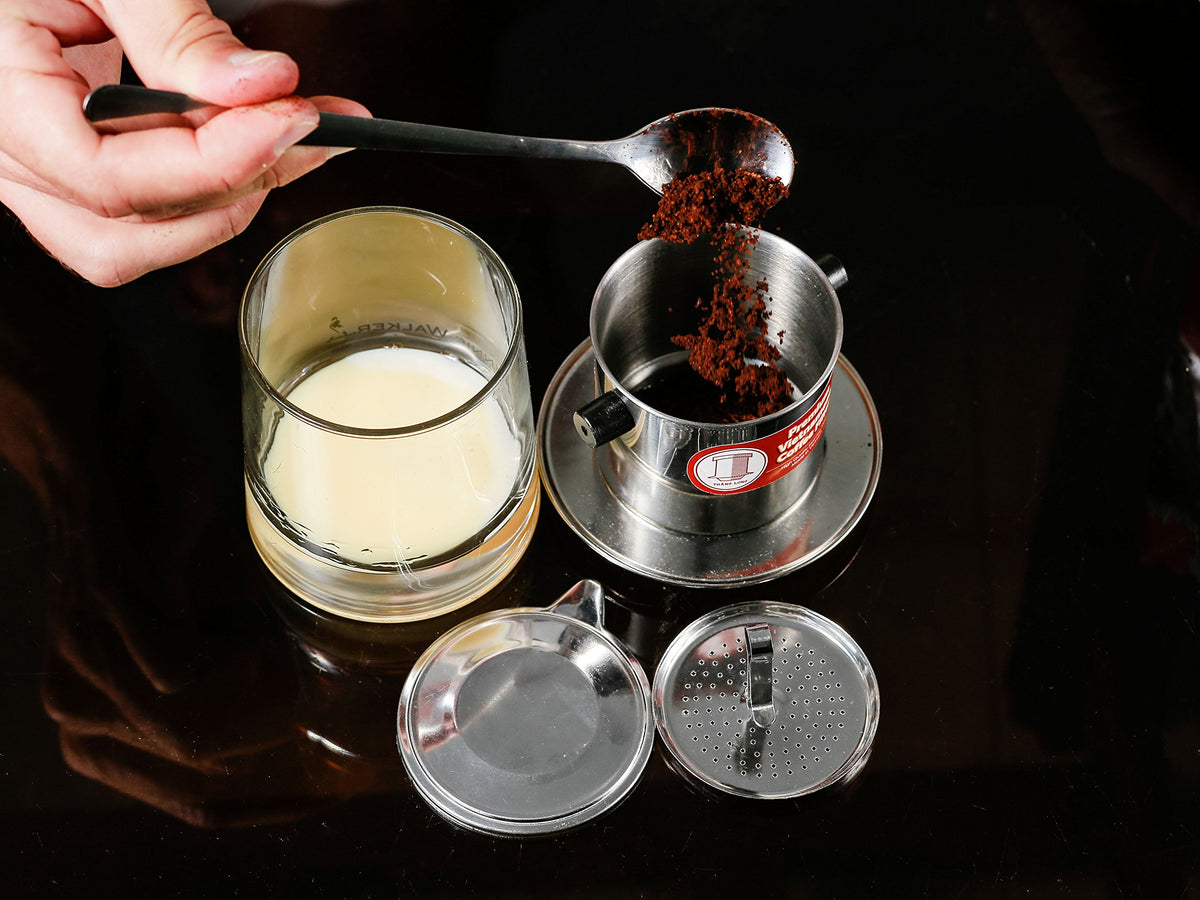 Filter brewing hot or iced coffee with traditional Vietnamese style