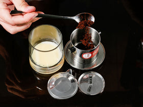 Filter brewing hot or iced coffee with traditional Vietnamese style