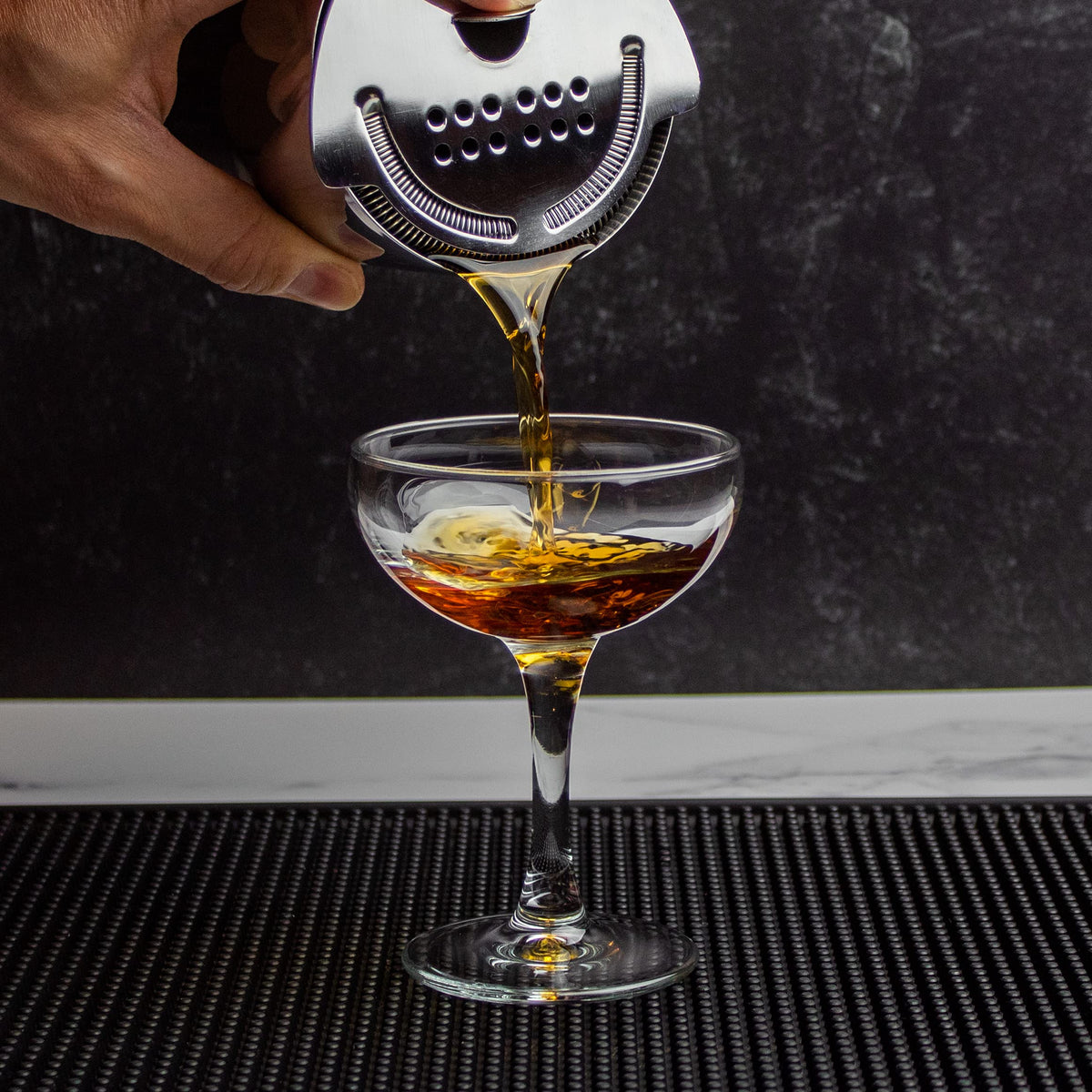 The Art of Craft Hawthorne Strainer on standard shaker tins, compatible for bar setups.