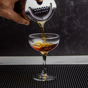The Art of Craft Hawthorne Strainer on standard shaker tins, compatible for bar setups.