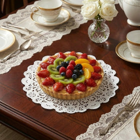 The Baker Celebrations 10-inch doilies frame entrees with refined contrast.