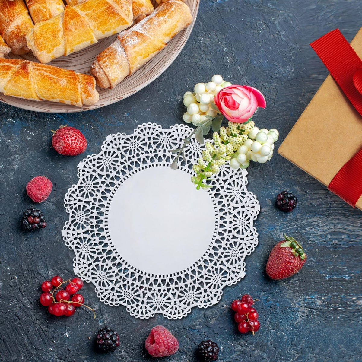 The Baker Celebrations 12-inch doilies lend wedding-table charm and protection.