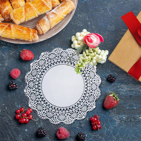 The Baker Celebrations 12-inch doilies lend wedding-table charm and protection.