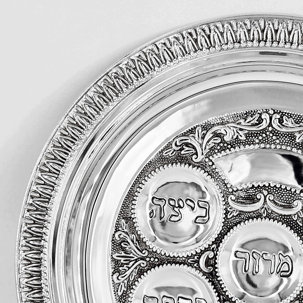Festive Pesach table setup featuring The Dreidel Company Seder plate centerpiece.