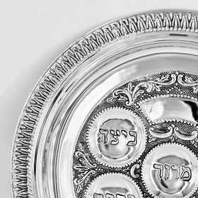 Festive Pesach table setup featuring The Dreidel Company Seder plate centerpiece.