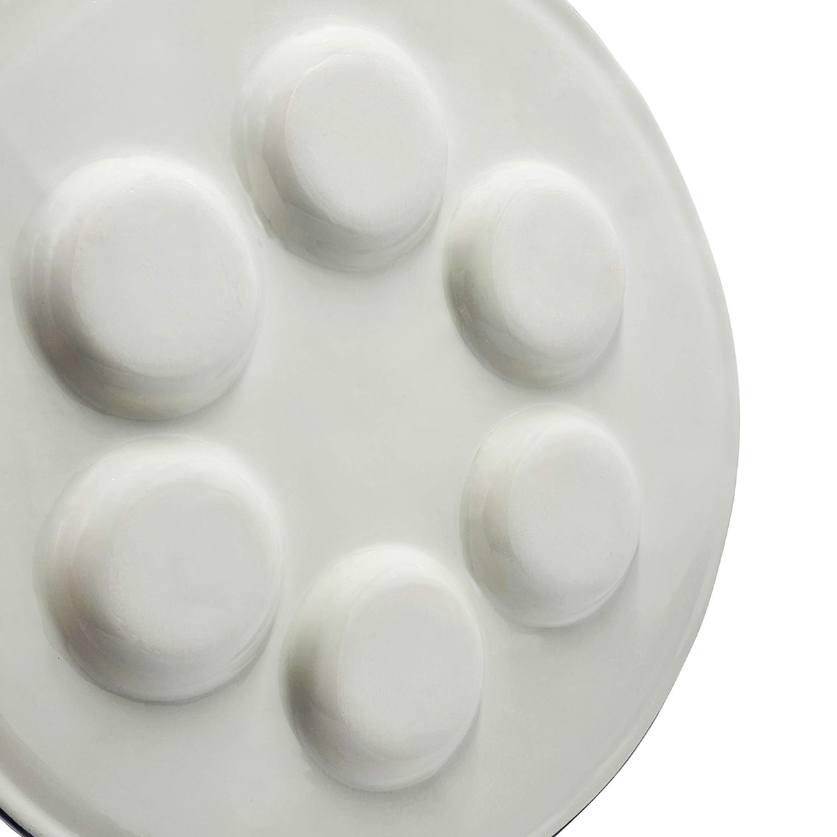 The Dreidel Company Seder plate shows Hebrew and English labels for ritual foods.