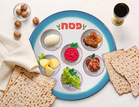 The Kosher Cook seder plate with pictures highlights each item for kid-friendly learning.
