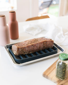 The Silicone Kitchen flexible modular roasting rack setup for versatile oven use.