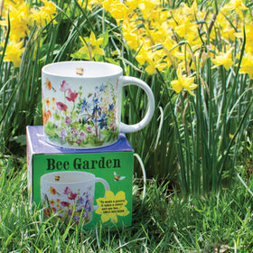 Bee Garden mug shows buzzing bees among blossoms, adding whimsy to your coffee break.