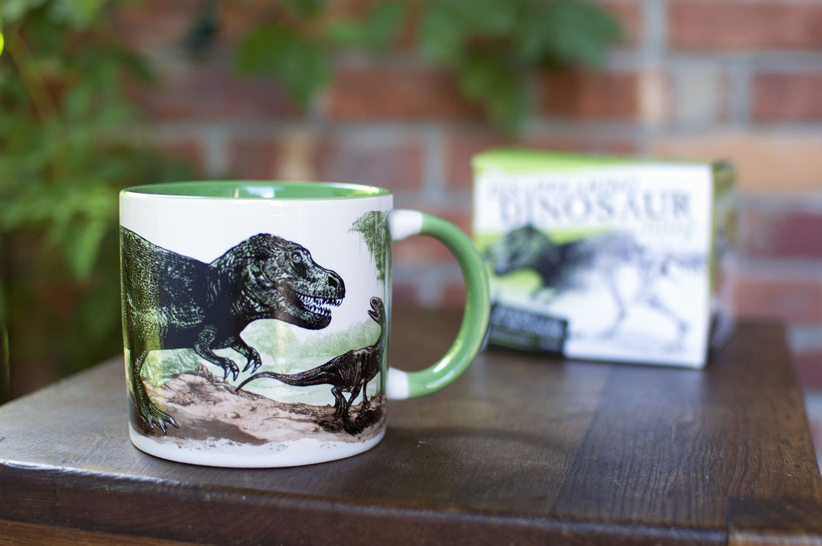 The Unemployed Philosophers Guild Disappearing Dino Mug close-up of heat-activated fossil reveal.