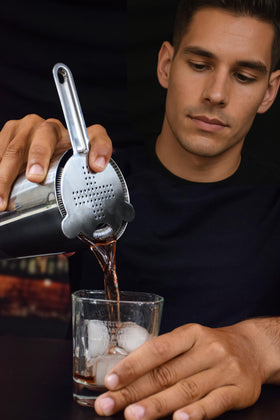 TheBarsentials Fine-Mesh Sifter filtering tiniest bits from a drink