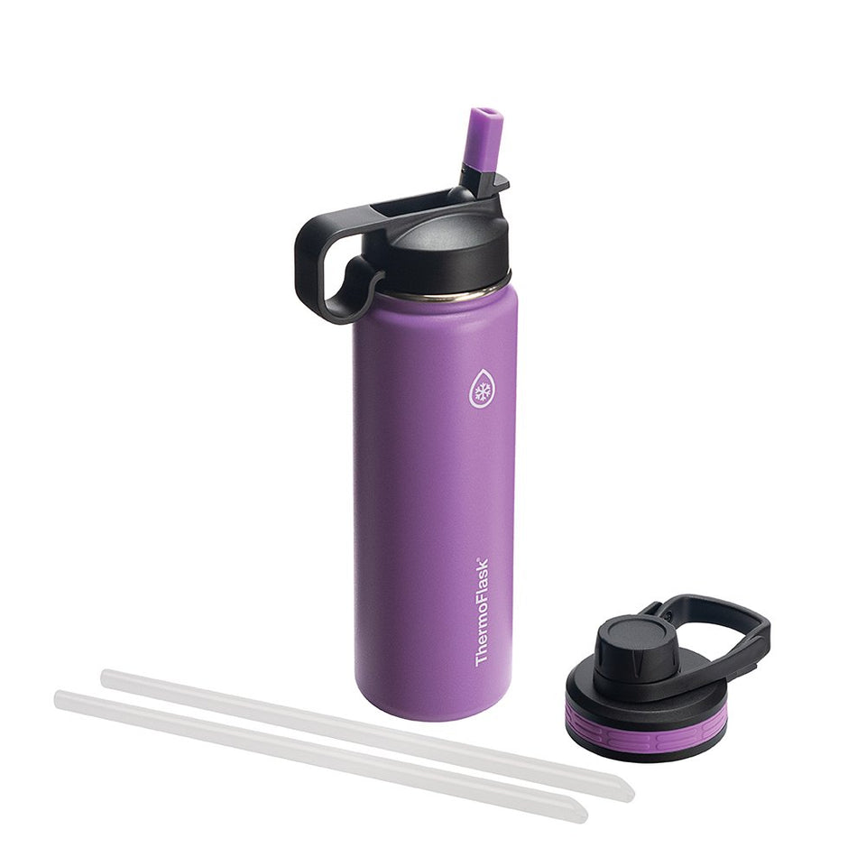 ThermoFlask 24 oz bottle pouring water outdoors, ideal for quick hydration during workouts.
