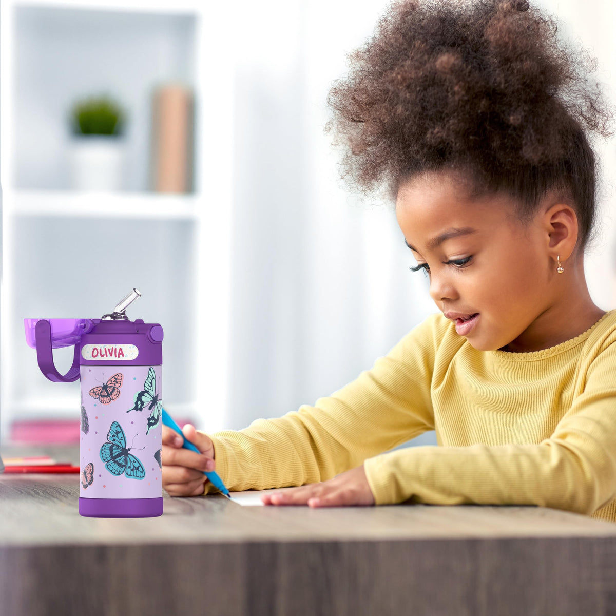 THERMOS FUNtainer Butterfly Frenzy colors inspire hydration and school-day excitement.