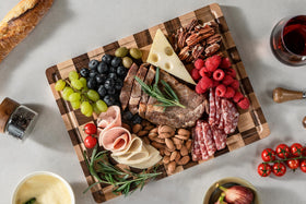 Thetchry charcuterie-side surface ideal for cheese and fruit.