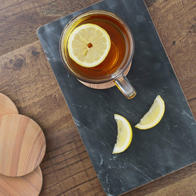 Thirstystone Cinnabar 4-inch round coaster showcasing natural sandstone with reliable moisture absorption.