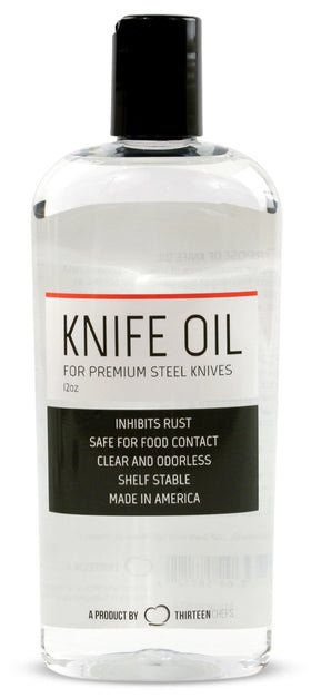 Thirteen Chefs honing oil bottle on counter protecting blades from rust.