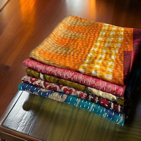 THRIVING kantha napkin close-up highlights handmade stitching and unique dye variations.