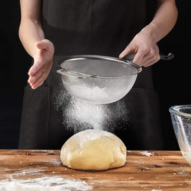 Tiawudi flour filter doubles as a pasta drainer for versatile kitchen tasks.