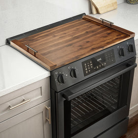 Tidita Acacia stove top cover in walnut finish protects counters with warmth.