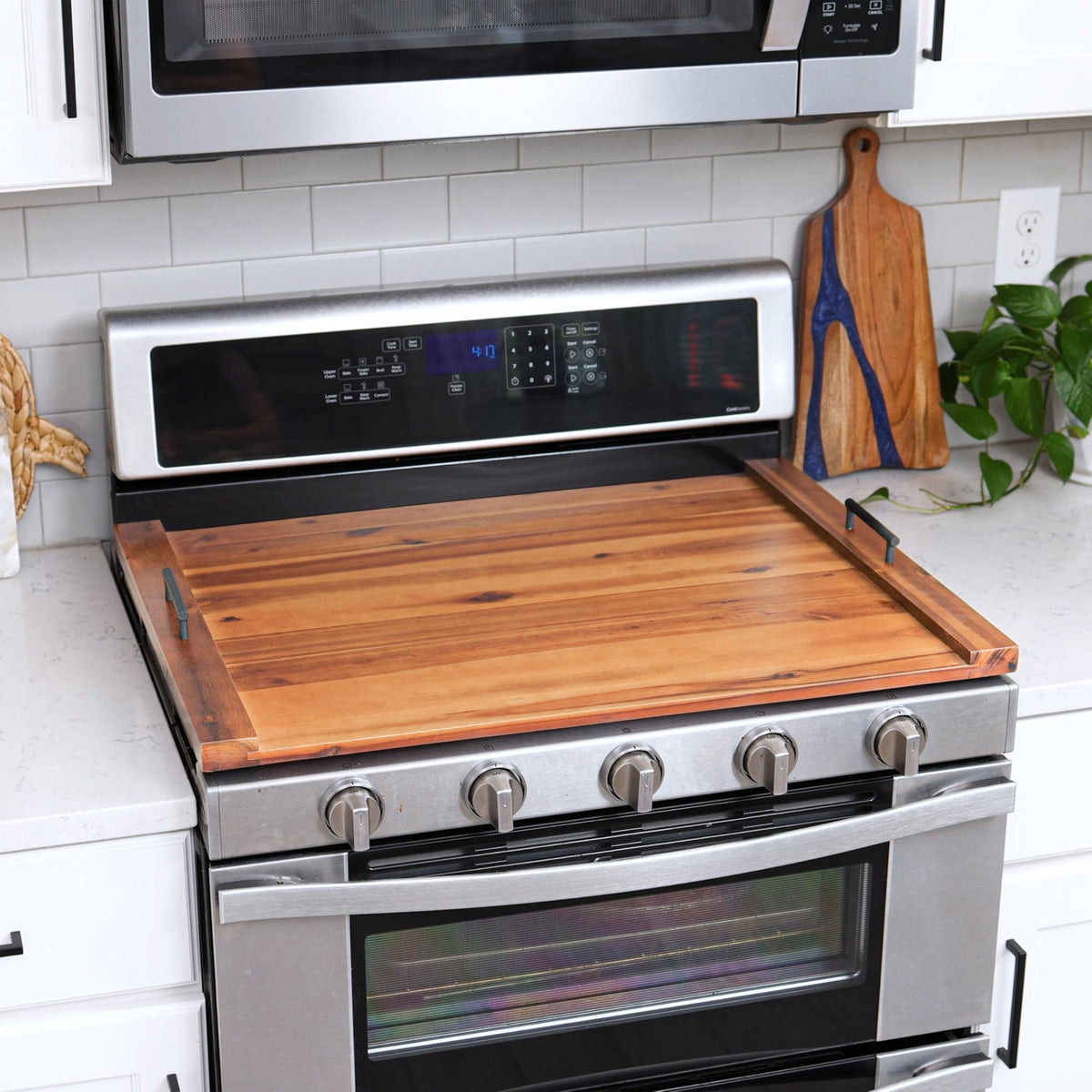 Tidita wood stove-top cover doubles as a stylish kitchen surface.