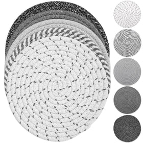 Tidponra Trivet Mats set in five colors protecting a table from hot dishes.