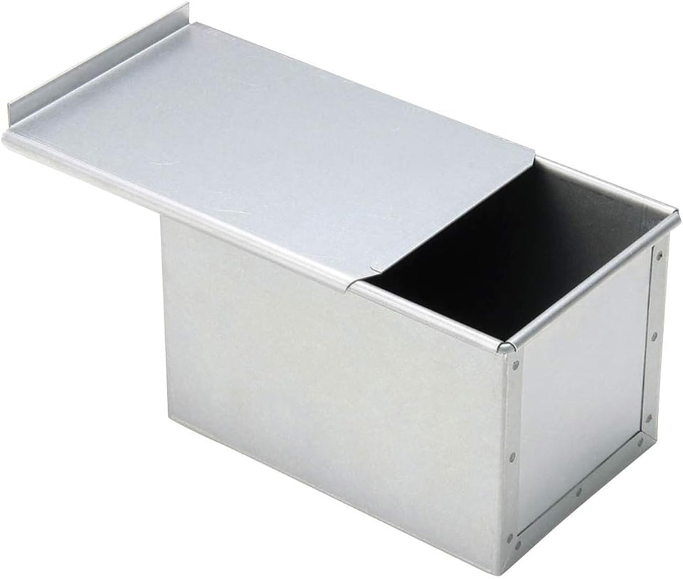 Tiger Crown silver bread mold with lid provides even heat for uniform loaves.