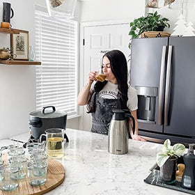 Tiken carafe in use for serving hot beverages.