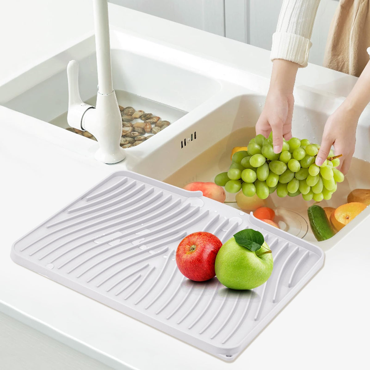TIKNIK easy-clean mat being rinsed to demonstrate quick maintenance.