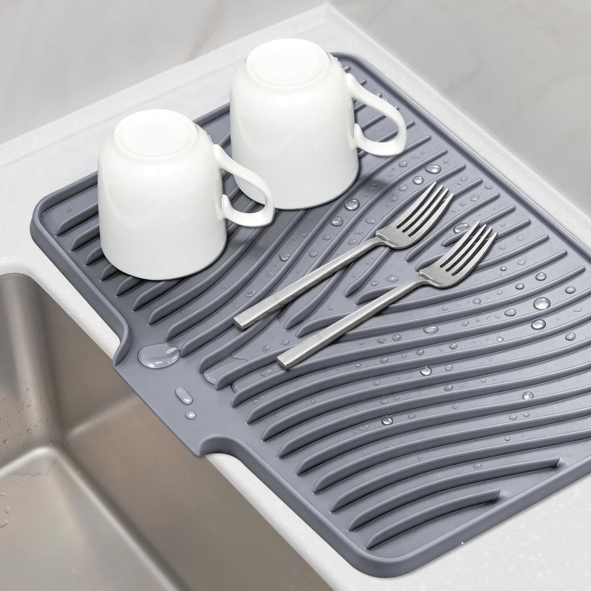 TIKNIK silicone dish drying mat with built-in drain supports fast kitchen air drying.