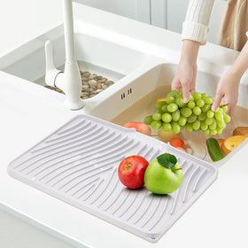 TIKNIK easy-clean silicone drying mat rolls up for simple storage.