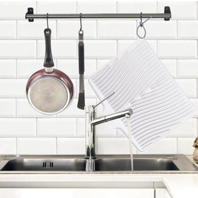 TIKNIK foldable silicone drying mat with a hanging hole for compact storage.