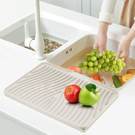 TIKNIK multifunction mat serves as liner, mat, and heat-safe surface.
