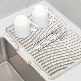 TIKNIK silicone drying mat on counter, top view emphasizes quick air drying.