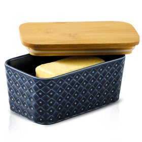Tikooere butter dish with navy lid keeps butter tidy and ready on kitchen counter.