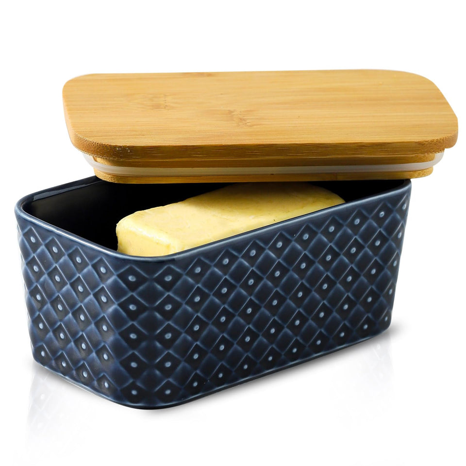 Tikooere butter dish with navy lid keeps butter tidy and ready on kitchen counter.