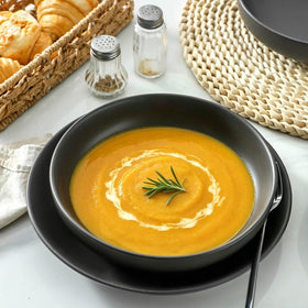 Tikooere matte black bowls with wide shallow design for pasta and salads.