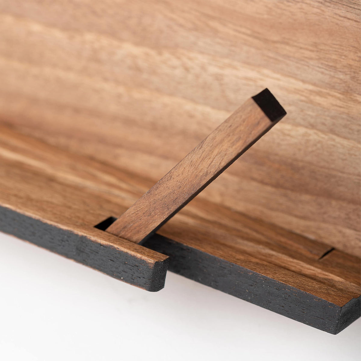 TILISMA lightweight walnut design offers portability and elegant home use.