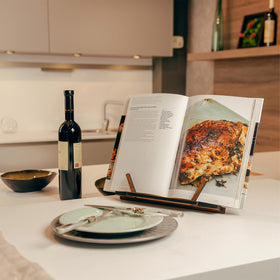 TILISMA walnut cookbook stand kitchen use demonstrates recipe reading with stable page support.