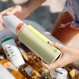 TILUCK Skinny Can Cooler lemon in-use image conveys party-ready portability.