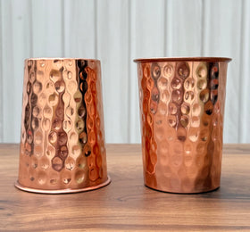 Timbrio 250 ml copper drinking cups shown as elegant, lightweight tumblers for guests.
