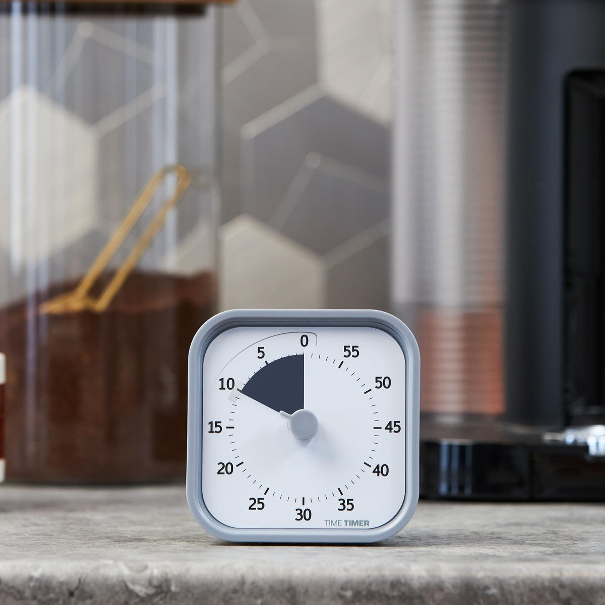 Time Timer MOD pale shale on desk setup illustrating an organized workspace.