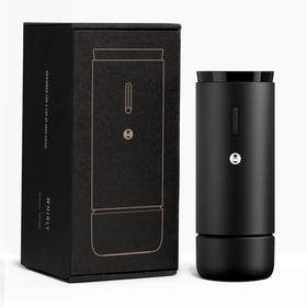 TIMEMORE Whirly portable grinder held in hand for on-the-go espresso.