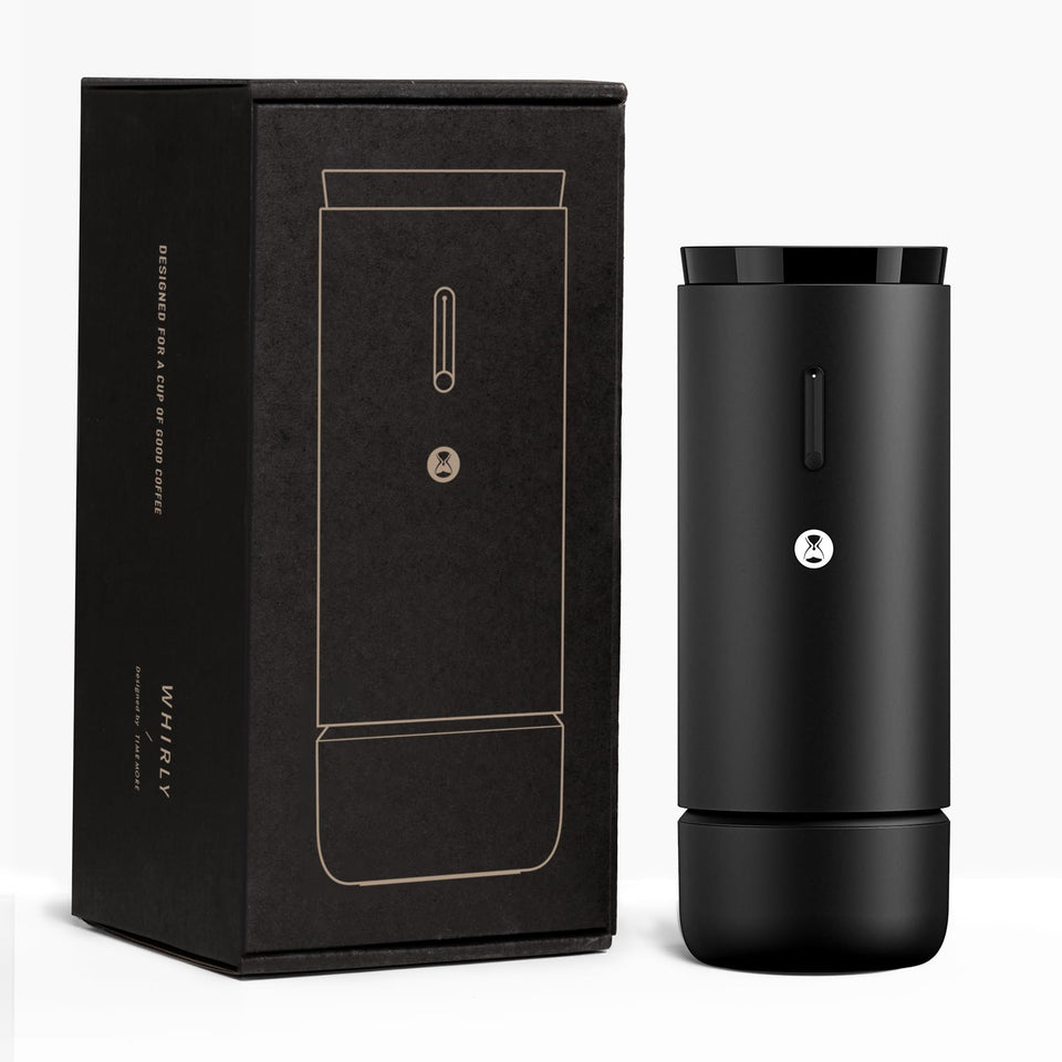 TIMEMORE Whirly portable grinder held in hand for on-the-go espresso.