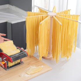 Tinada wooden pasta dryer base provides stable counter support during use.