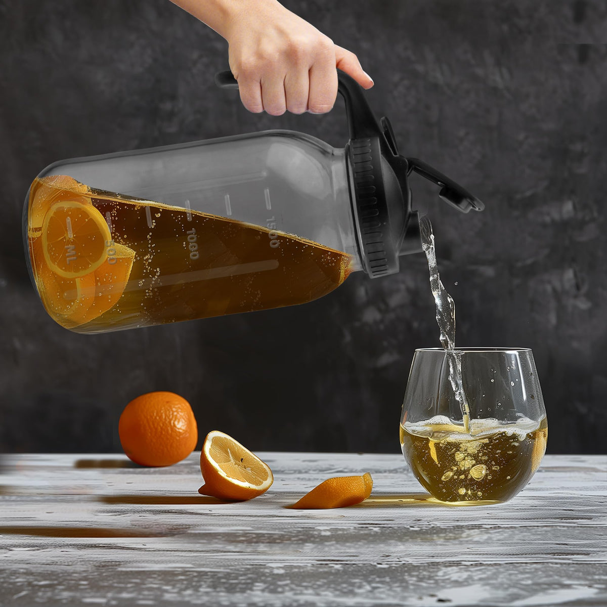 Tinaforld 64 oz glass pitcher pouring action for effortless serving