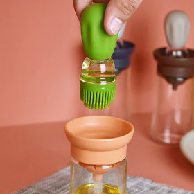 Multi-purpose dispenser ideal for oils, sauces, and marinades in the kitchen.
