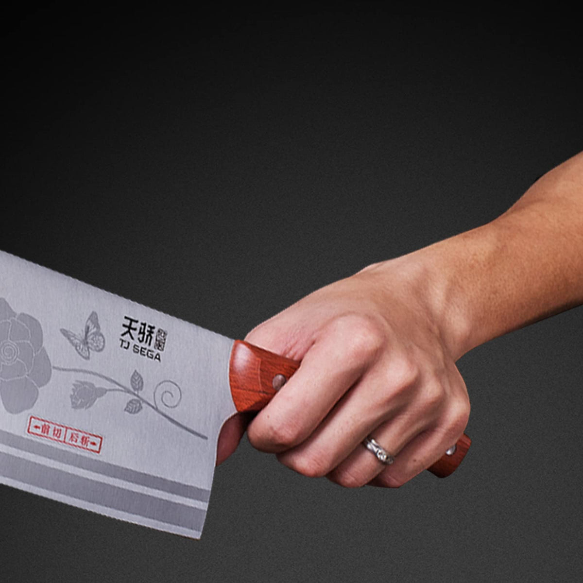 TJ POP meat cleaver full-tang construction with secure bolster for safety.