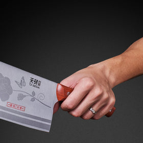 TJ POP meat cleaver full-tang construction with secure bolster for safety.
