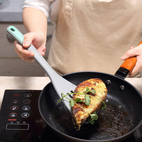 To encounter silicone fish spatula protects pans while turning delicate fish